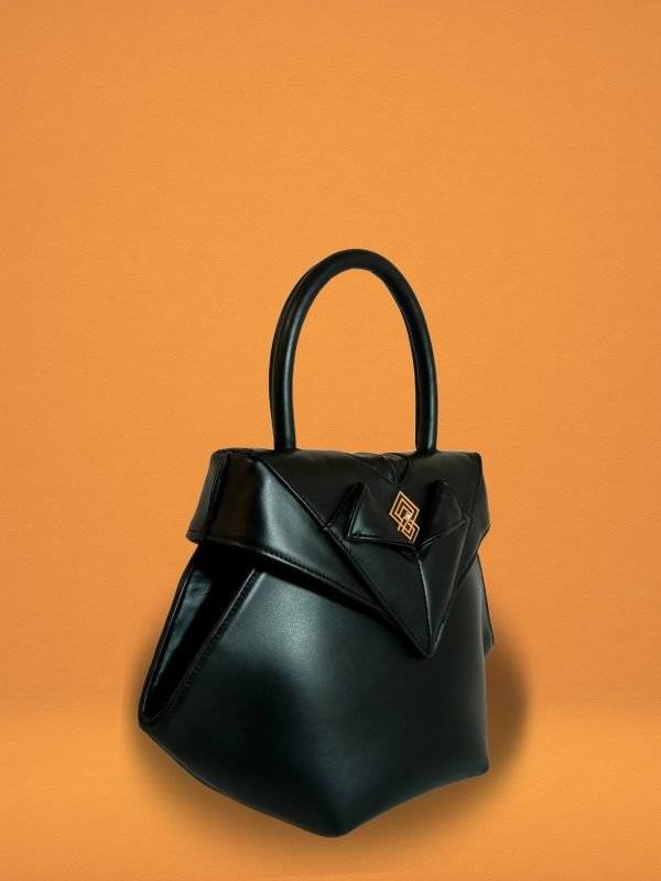 Side view of Miacontessa Amore origami style handbag in obsidian black Italian leather, highlighting its unique, folded design that creates an illusionary or artful aesthetic.