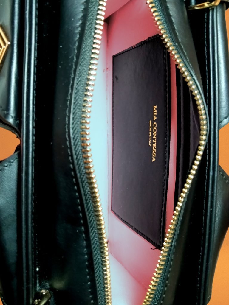 Inside view of Miacontessa Arte origami style handbag in obsidian black Italian leather, highlighting its unique, folded design that creates an illusionary or artful aesthetic.
