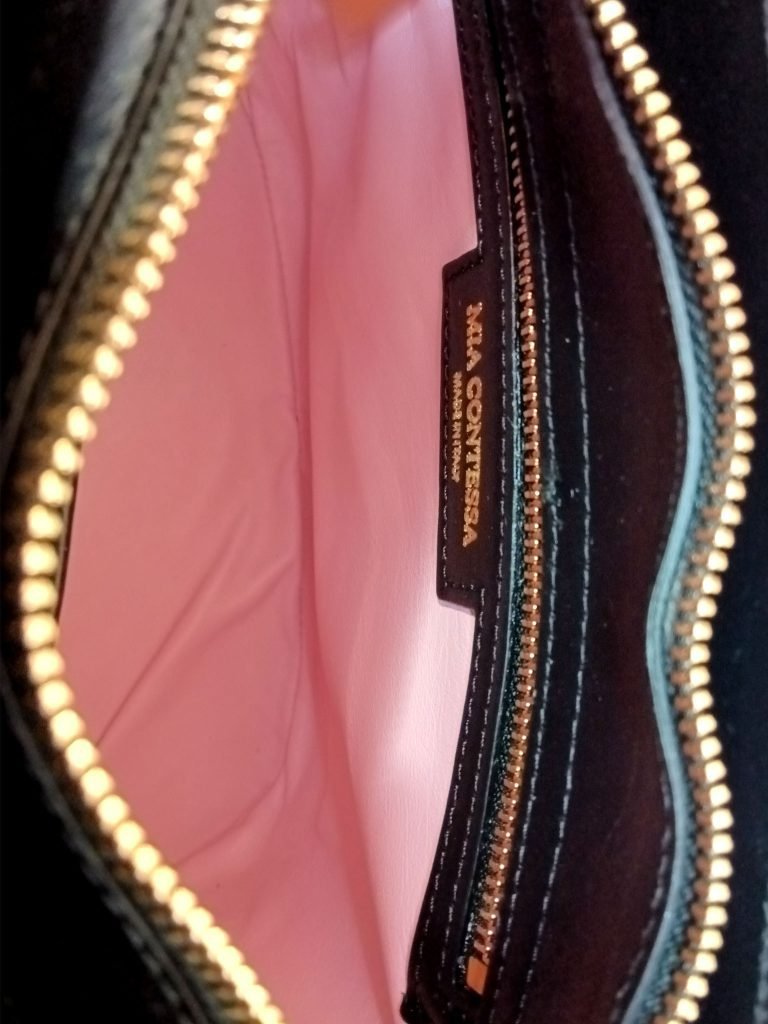 Inside view of Miacontessa Florella origami style handbag in obsidian black Italian leather, highlighting its unique, folded design that creates an illusionary or artful aesthetic.