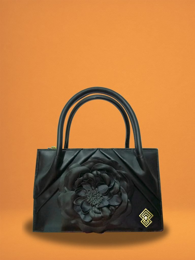 Front view of Miacontessa Florella Rosa origami style handbag in obsidian black Italian leather, highlighting its unique, folded design that creates an illusionary or artful aesthetic.