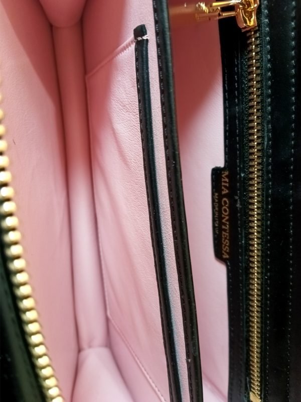 Inside view of Miacontessa Florella Rosa origami style handbag in obsidian black Italian leather, highlighting its unique, folded design that creates an illusionary or artful aesthetic.