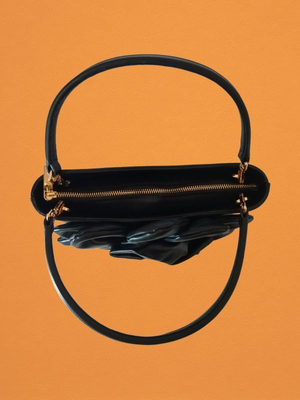 Top view of Miacontessa Florella origami style handbag in obsidian black Italian leather, highlighting its unique, folded design that creates an illusionary or artful aesthetic.