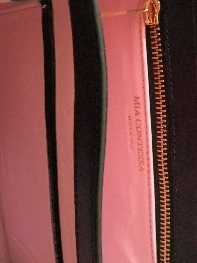Inside view of Miacontessa Magia origami style handbag in obsidian black Italian leather, highlighting its unique, folded design that creates an illusionary or artful aesthetic.
