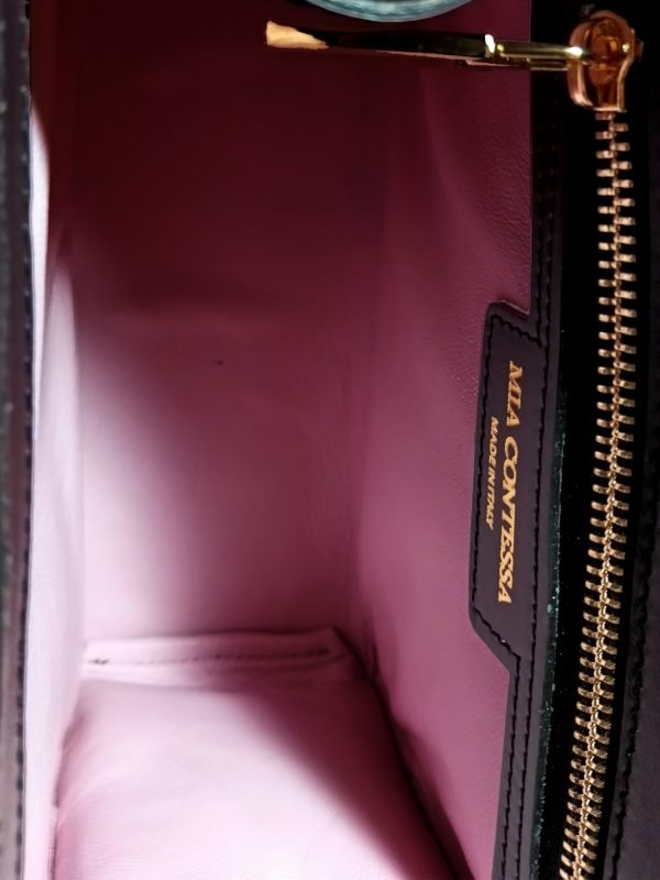 Inside view of Miacontessa Vita origami style handbag in obsidian black Italian leather, highlighting its unique, folded design that creates an illusionary or artful aesthetic.